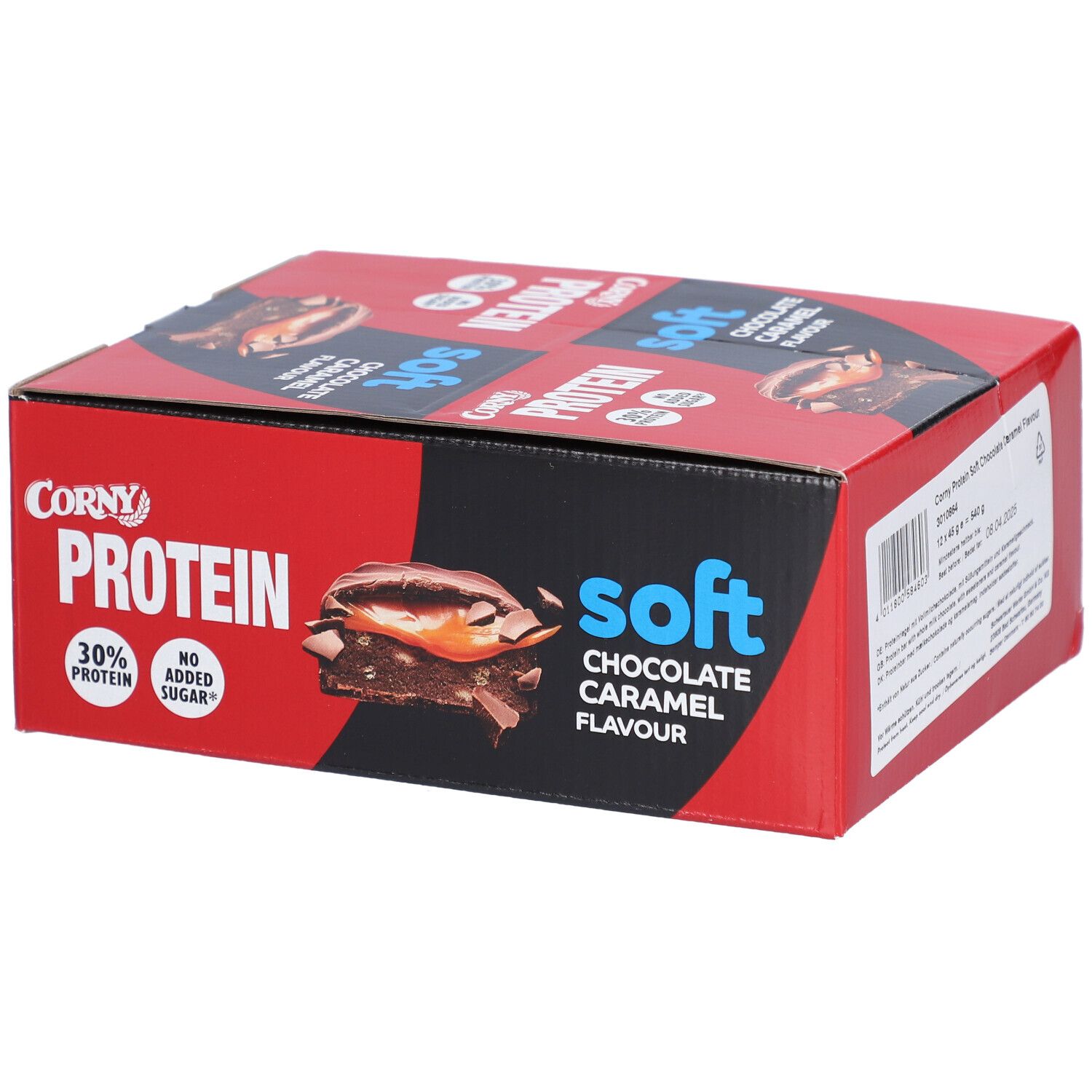Rote und schwarze Schachtel mit Corny Protein Soft. Aufdruck: Schokolade-Karamell-Geschmack, 30% Protein, ohne Zuckerzusatz.