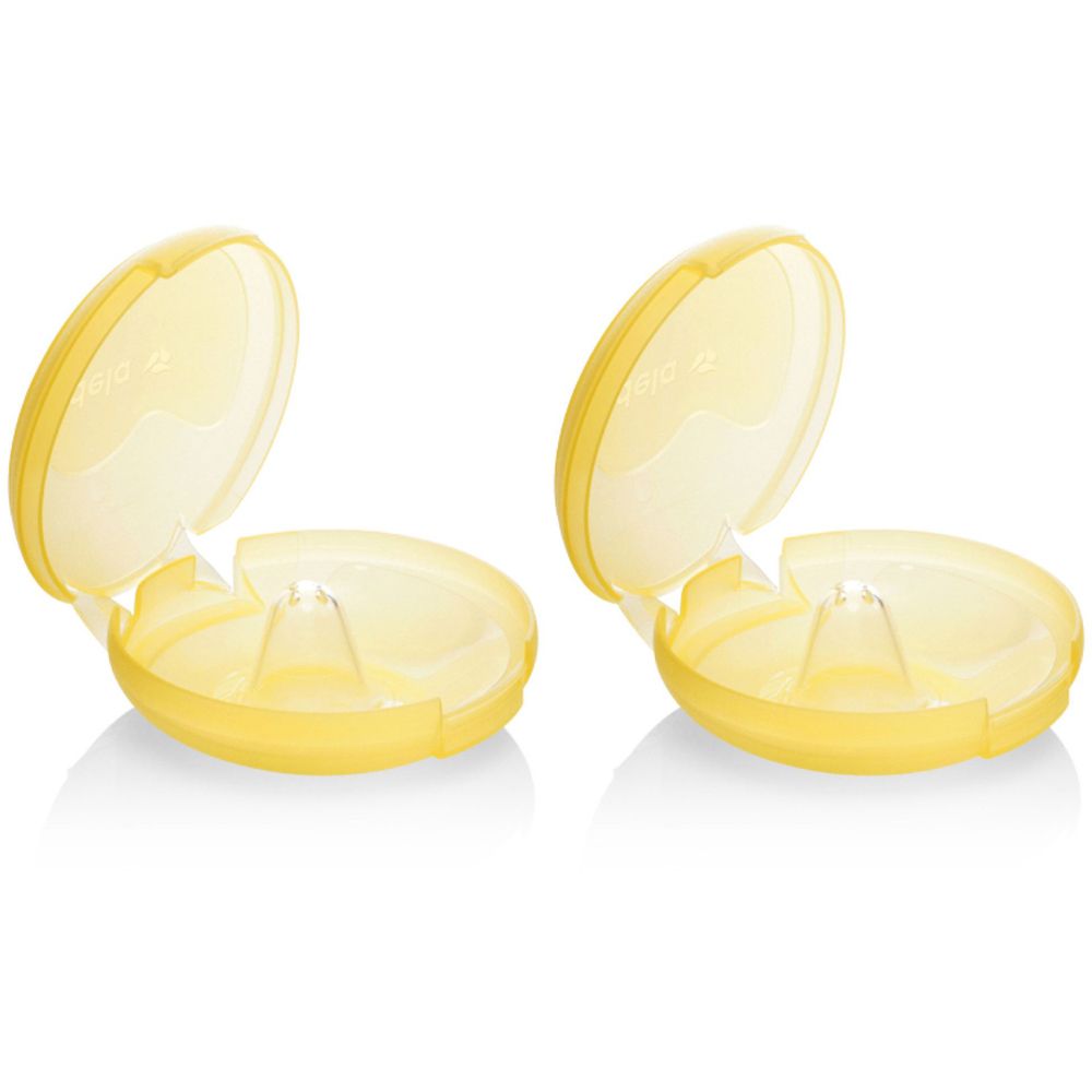 Zwei gelbe Brusthütchen in geöffneten Behältern. Die Behälter sind oval und haben einen Deckel. Die Hütchen sind durchsichtig.