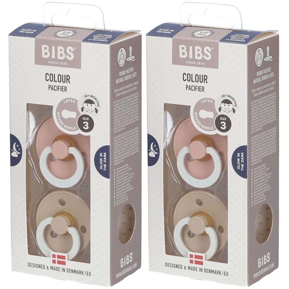 Zwei BIBS® Schnuller in Verpackung. Rosa und beige Sauger mit weißem Ring. Größe 3, für 18+ Monate. Verpackung mit Sichtfenster.