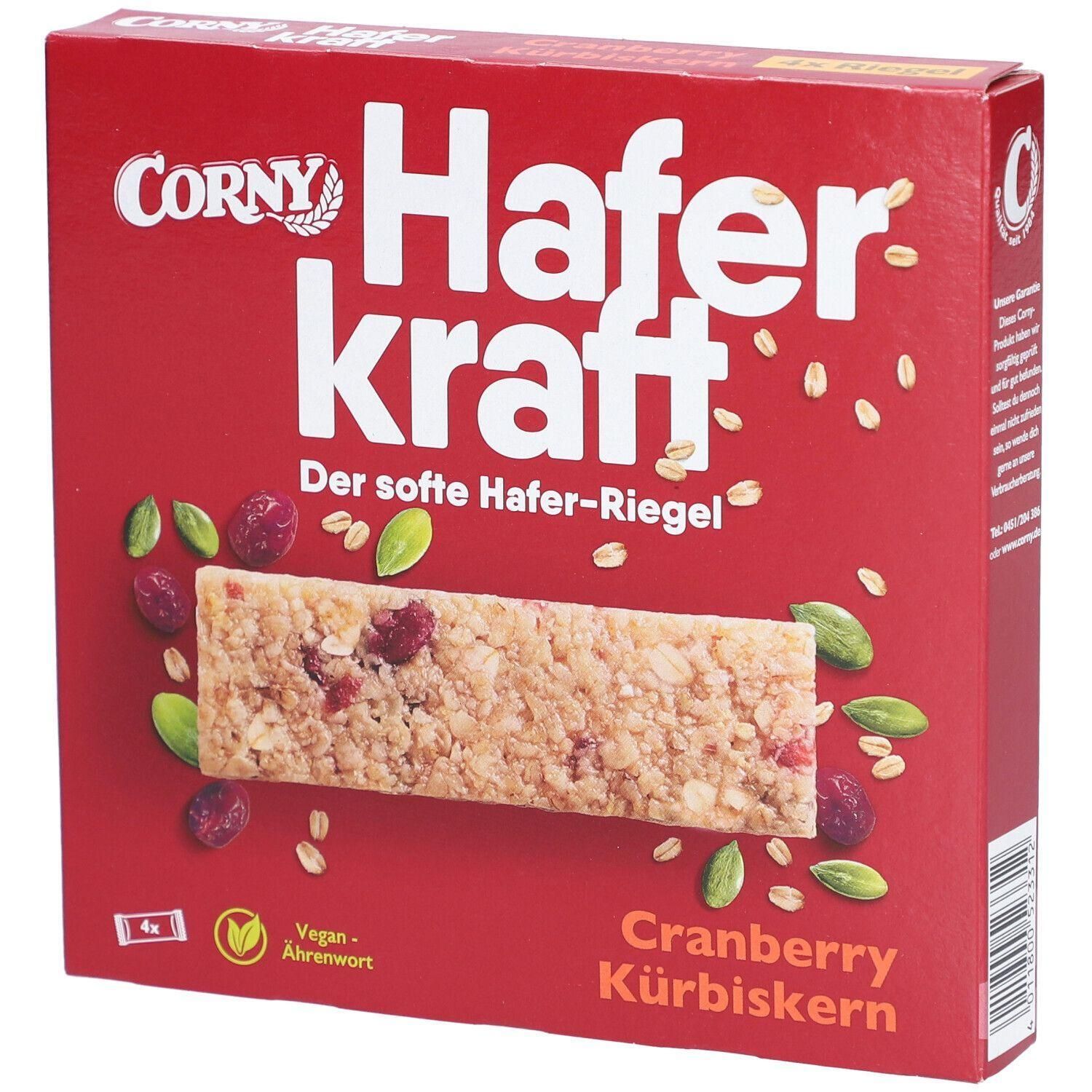 Corny Haferkraft Riegel mit Cranberry und Kürbiskern auf roter Verpackung.