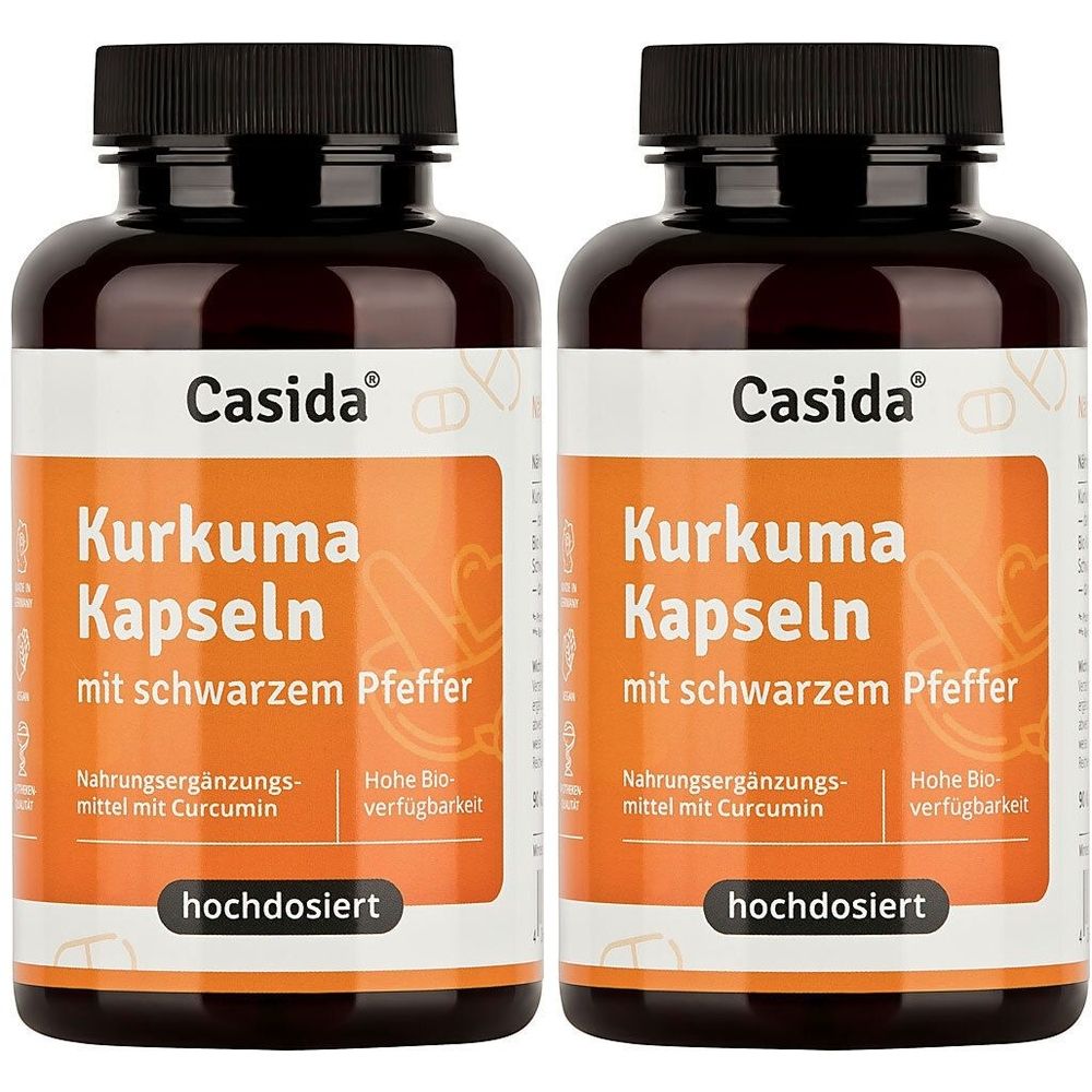 Zwei Flaschen Casida Kurkuma Kapseln mit schwarzem Pfeffer. Braune Flaschen mit schwarzen Deckeln und orangefarbenen Etiketten.