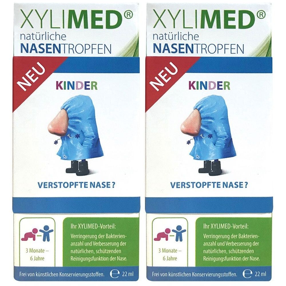 Zwei Packungen Xylimed Nasentropfen für Kinder. Aufdrucke: Xylimed, Nasentropfen, Kinder, Neu, verstopfte Nase. Illustration: Nase mit Mantel.