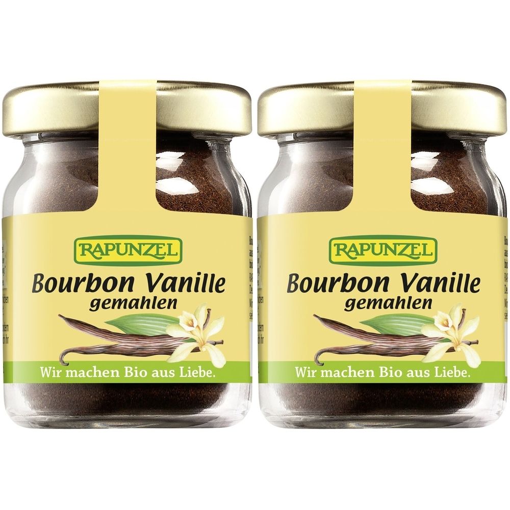 Zwei Gläser RAPUNZEL Bourbon Vanille. Etikett mit Produktname, Vanilleschote und Blüte. Goldfarbener Deckel, gelbes Etikett.