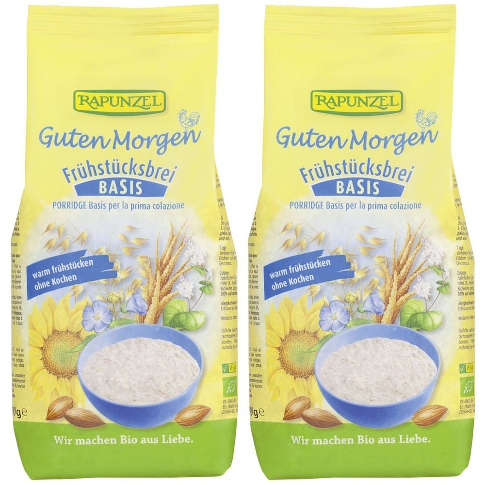 Zwei Beutel RAPUNZEL Frühstücksbrei. Aufdruck: Guten Morgen Frühstücksbrei BASIS. Abbildung: Sonnenblume, Getreideähre, Schüssel mit Brei.