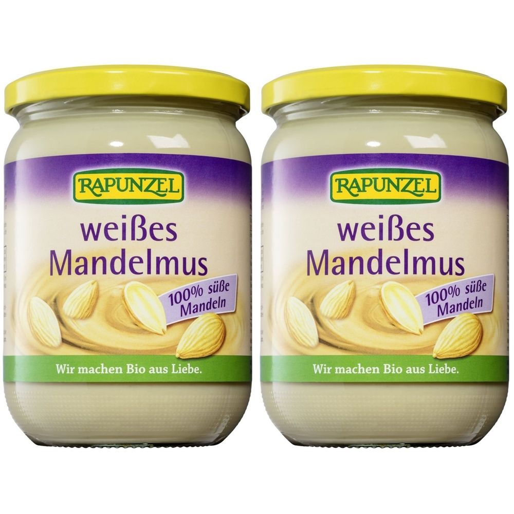 Zwei Gläser Mandelmus mit gelben Deckeln. Aufschrift: RAPUNZEL weißes Mandelmus, 100% süße Mandeln. Aufschrift: Wir machen Bio aus Liebe.