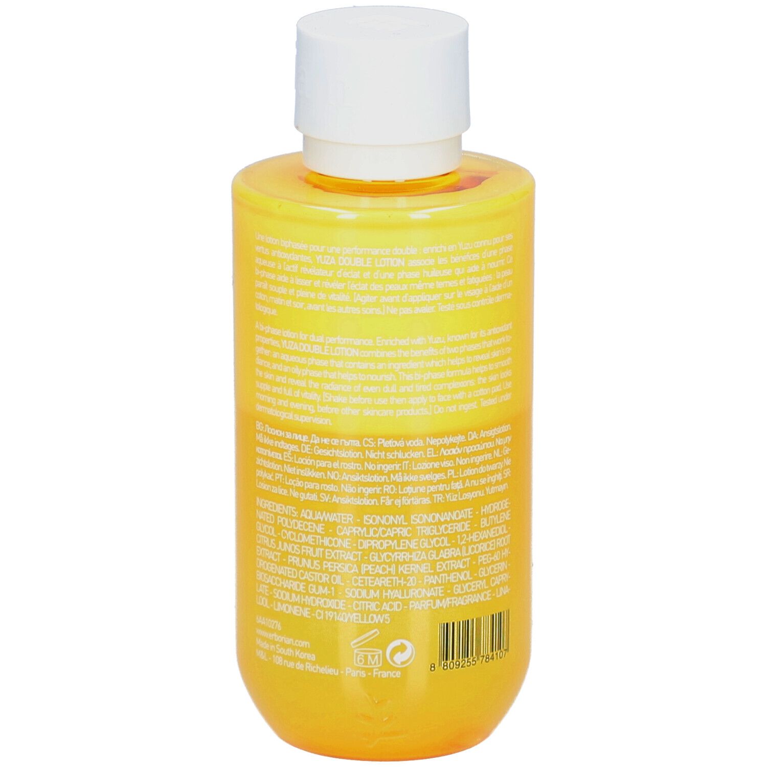 Gelbe Flasche mit weißem Deckel. Rückseite mit Text. Yuza Double Lotion.
