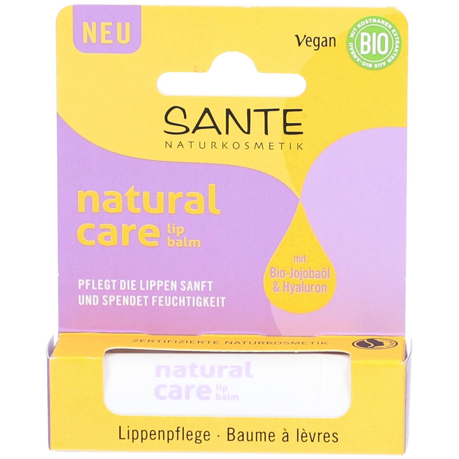 Lippenbalsam in Verpackung. Gelbe und lila Verpackung mit Produktnamen und Bio-Siegel. Vegan.