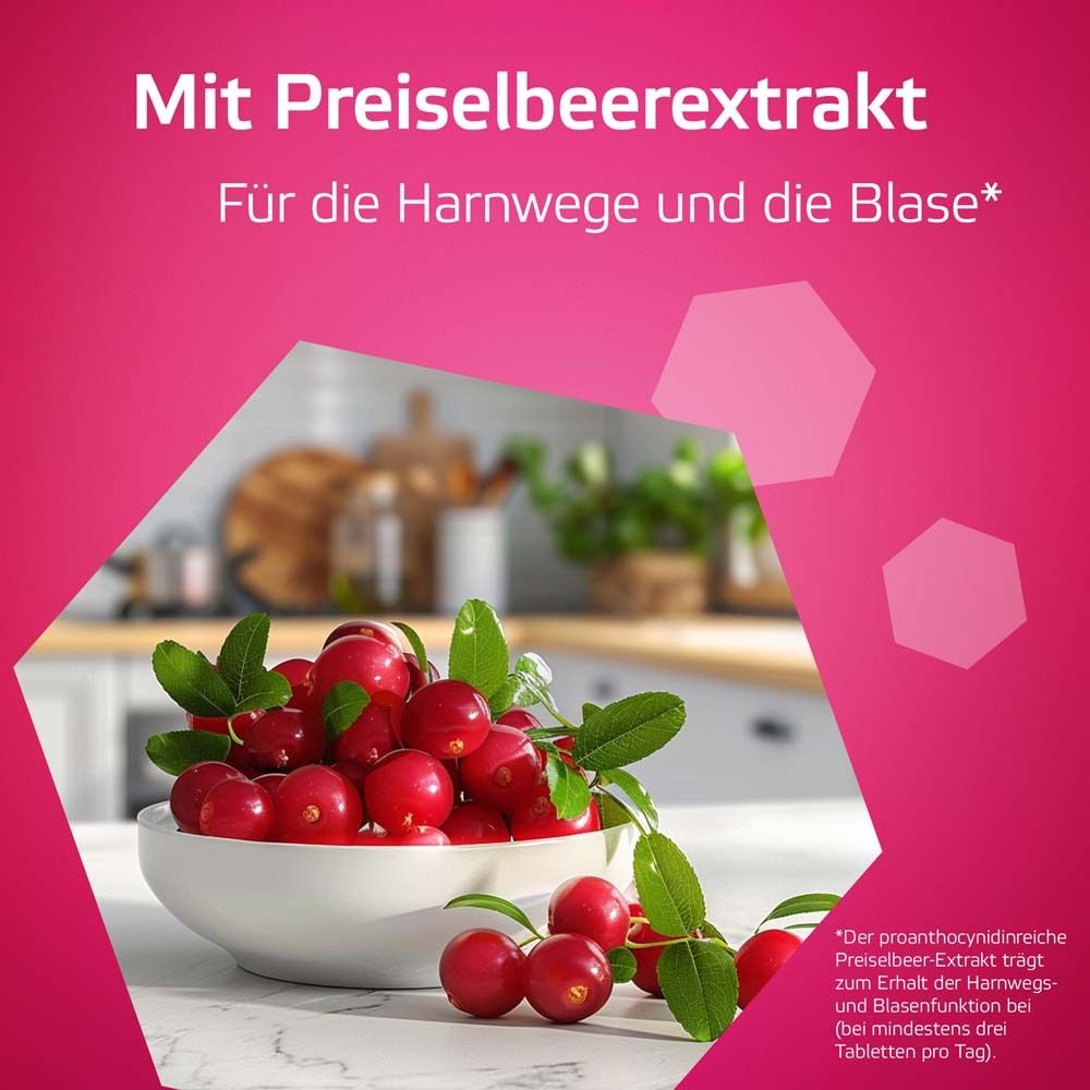 Schüssel mit roten Preiselbeeren und Blättern. Text: Mit Preiselbeerextrakt. Für die Harnwege und die Blase.