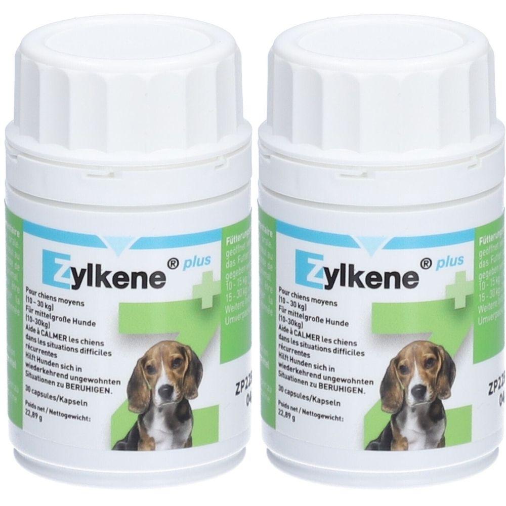 Zwei weiße Pillendosen mit Schraubverschluss. Aufschrift: Zylkene plus. Abbildung eines Hundes. Text in Deutsch, Französisch und Englisch.