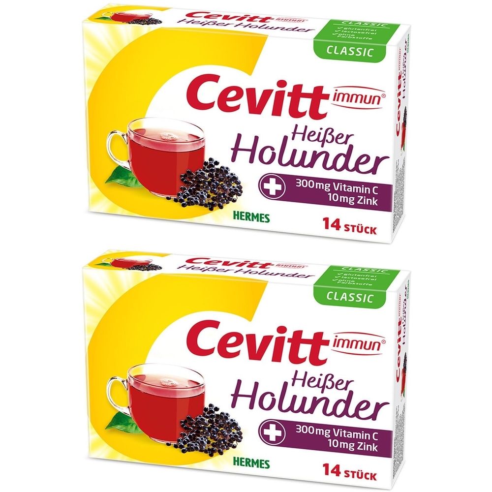 Zwei Schachteln Cevitt immun Heißer Holunder. Aufdrucke: 300mg Vitamin C, 10mg Zink, 14 Stück. Hermes-Logo. Abbildung einer Tasse mit Getränk.