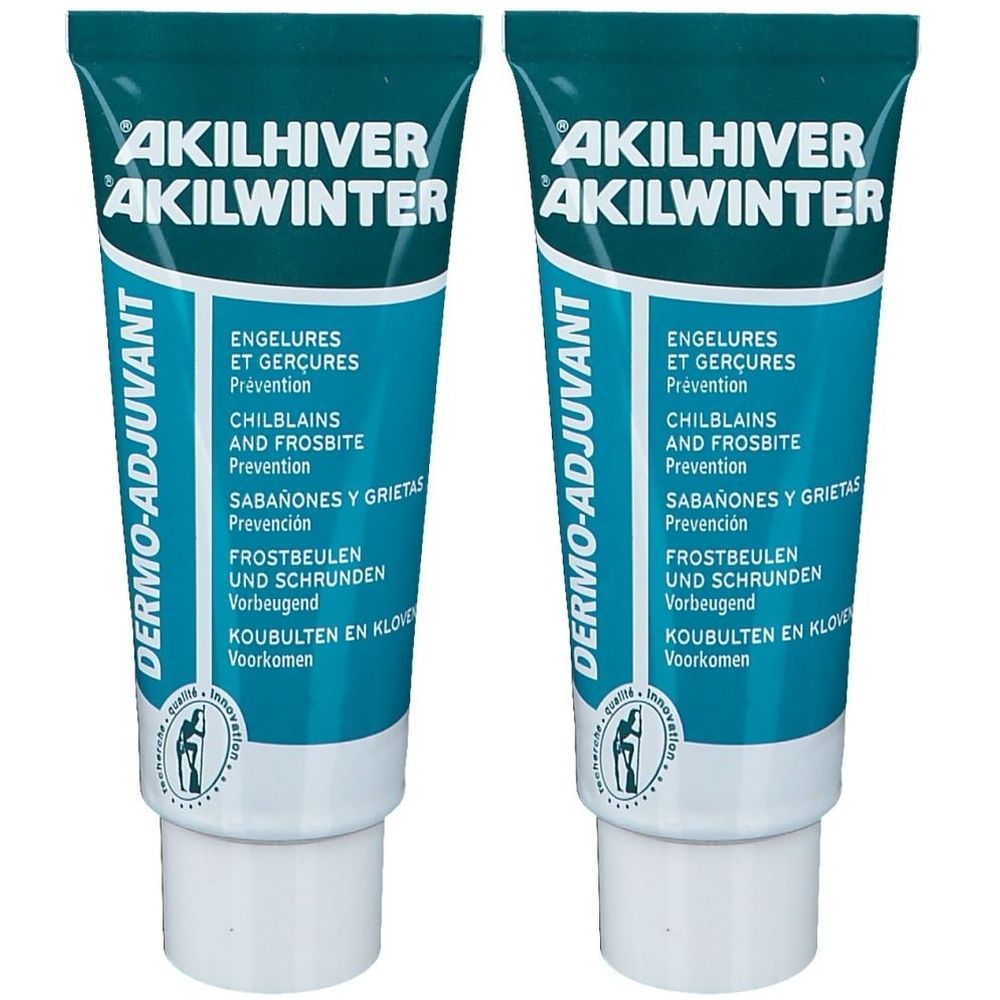 Zwei Tuben AKILWINTER® Dermo-Adjuvans. Türkis-weiße Verpackung mit Produktnamen und Text in mehreren Sprachen. Enthält Informationen zu Frostbeulen.