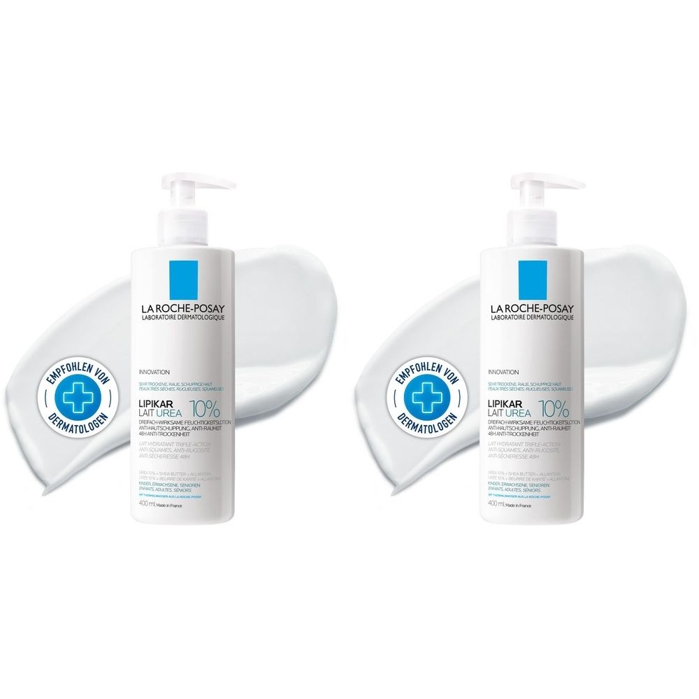 Zwei Flaschen La Roche-Posay Lipikar Lait Urea 10% mit Spender. Aufschrift: Empfohlen von Dermatologen. Weiße Lotion-Spuren.