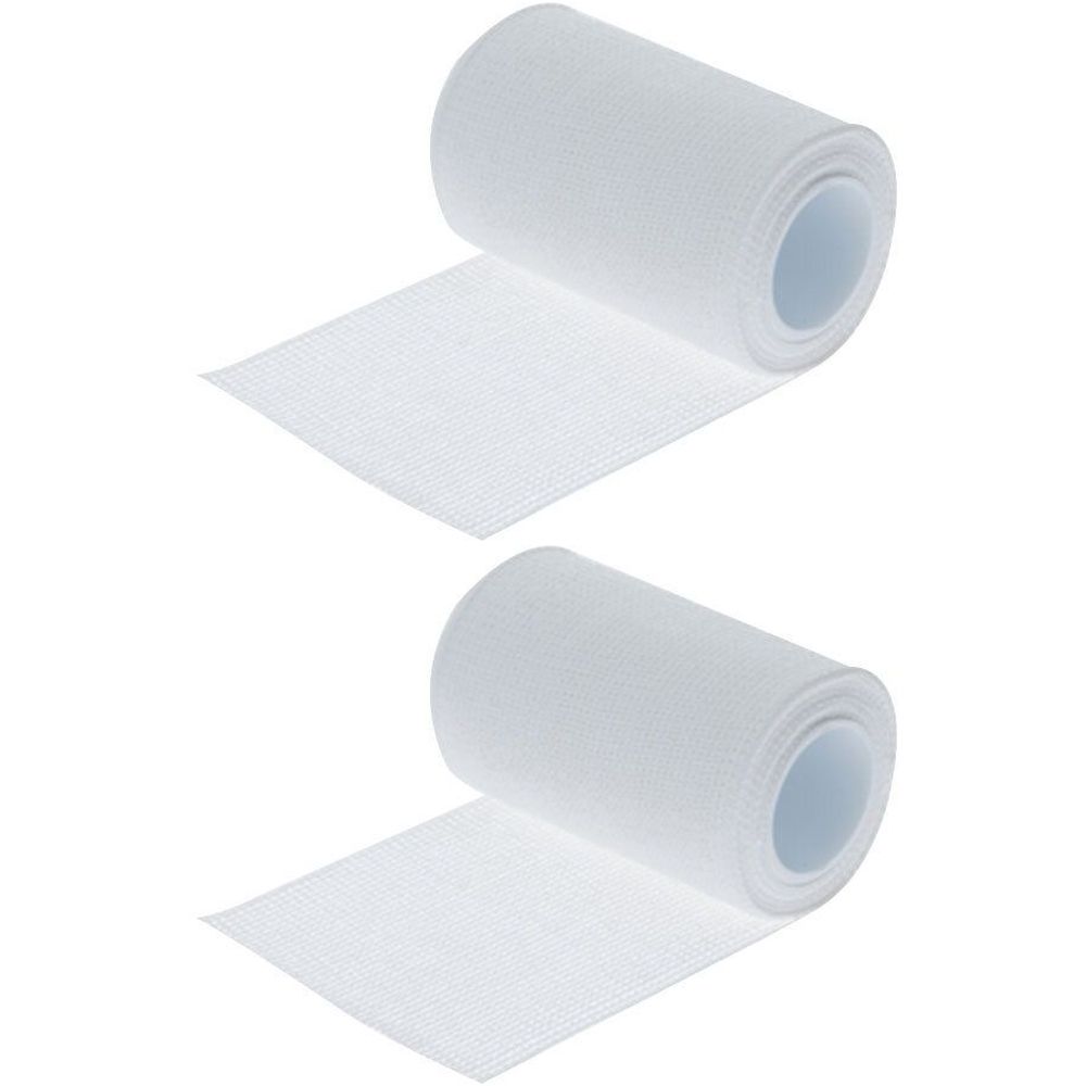 Zwei weiße, gerollte medizinische Bandagen. Die Enden sind abgerollt.