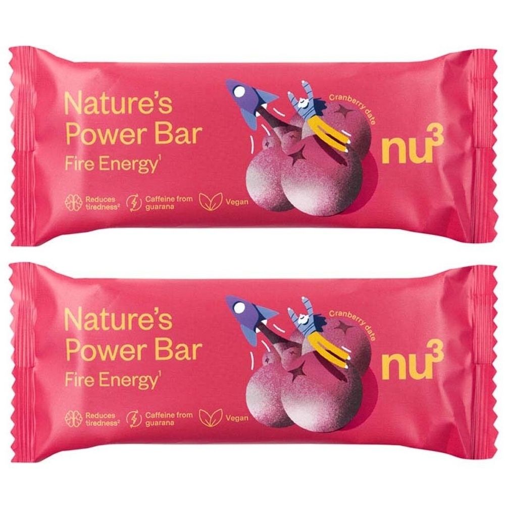 Zwei Riegel "Nature's Power Bar Fire Energy" in rosa Verpackung. Mit Illustrationen und Texten wie "Vegan" und "Cranberry Date".