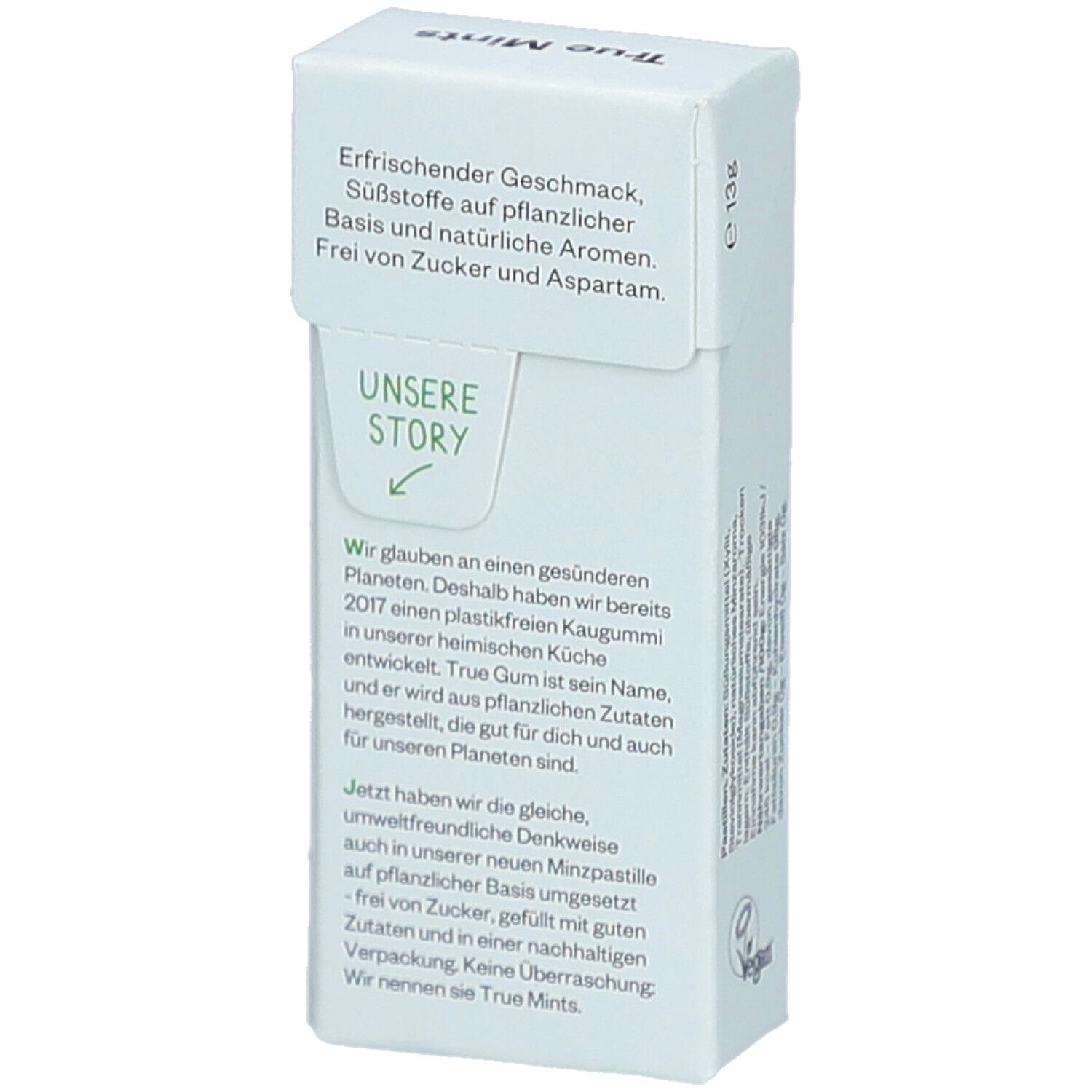 Weißer Karton mit Text über Geschmack, Inhaltsstoffe und Unternehmensgeschichte. Vegan-Siegel.