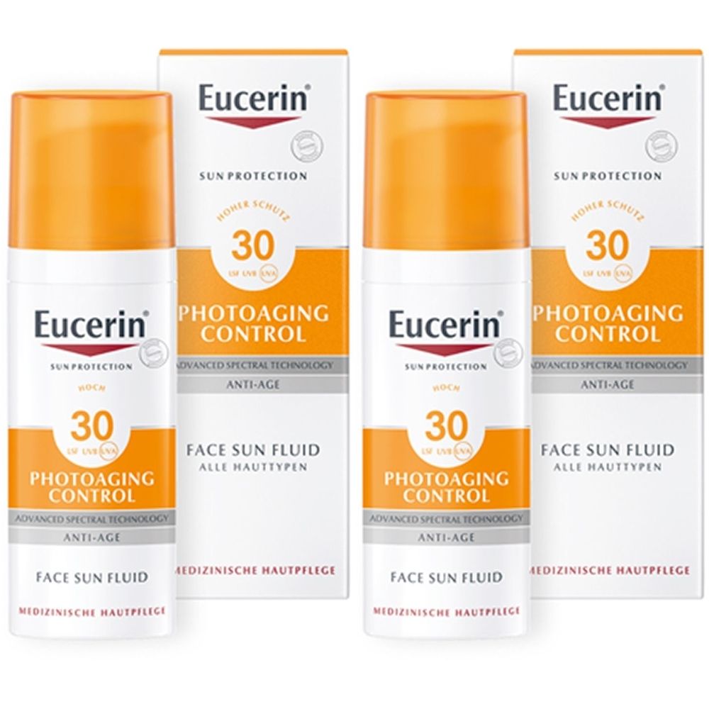 Drei Flaschen und Verpackungen von Eucerin Sonnenschutz. Aufschrift: Photoaging Control, LSF 30. Weiße Flaschen mit orangefarbenem Deckel.