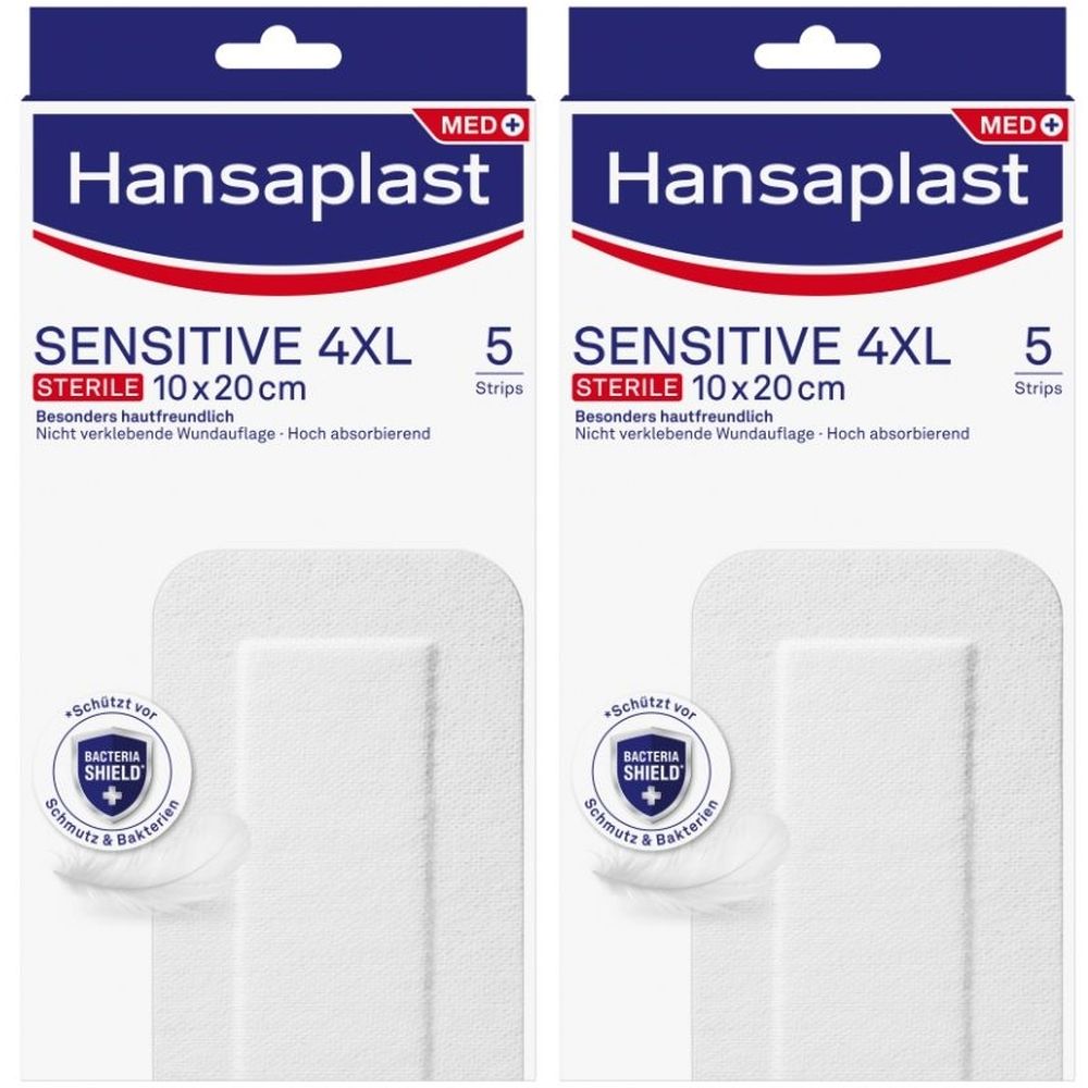 Zwei Packungen Wundpflaster. Aufschrift: Hansaplast Sensitive 4XL, steril, 10x20cm, 5 Stück. Mit Bacteria Shield. Weiße Pflaster.