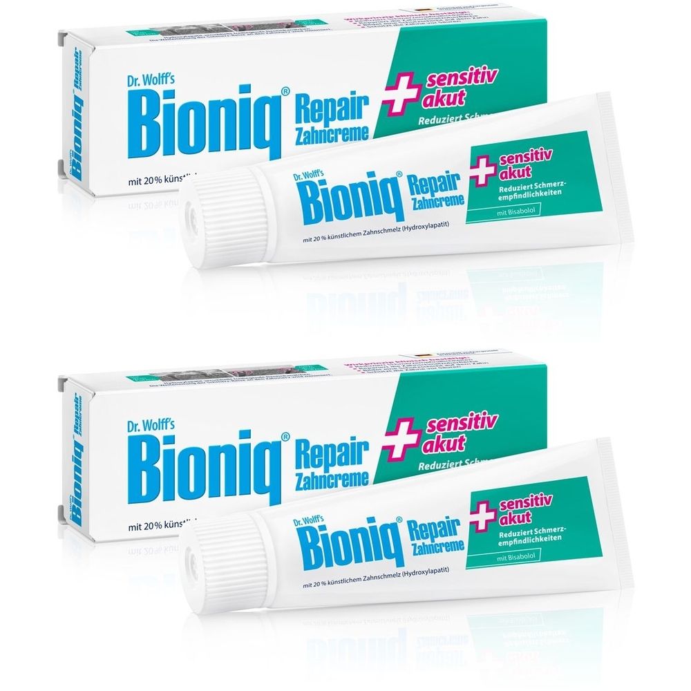 Zahnpasta und Verpackung. Produktname: Bioniq Repair + sensitiv akut. Weiße Tube und Schachtel mit blauer und grüner Schrift.
