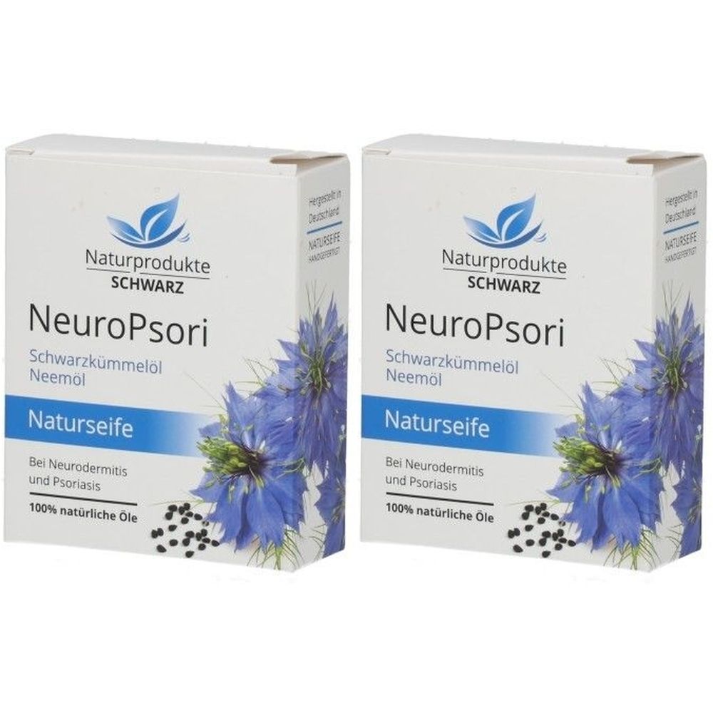 Zwei weiße Kartons mit Produktaufdruck. Aufschrift: NeuroPsori Naturseife, Schwarzkümmelöl, Neemöl. Blaue Blütenabbildung.
