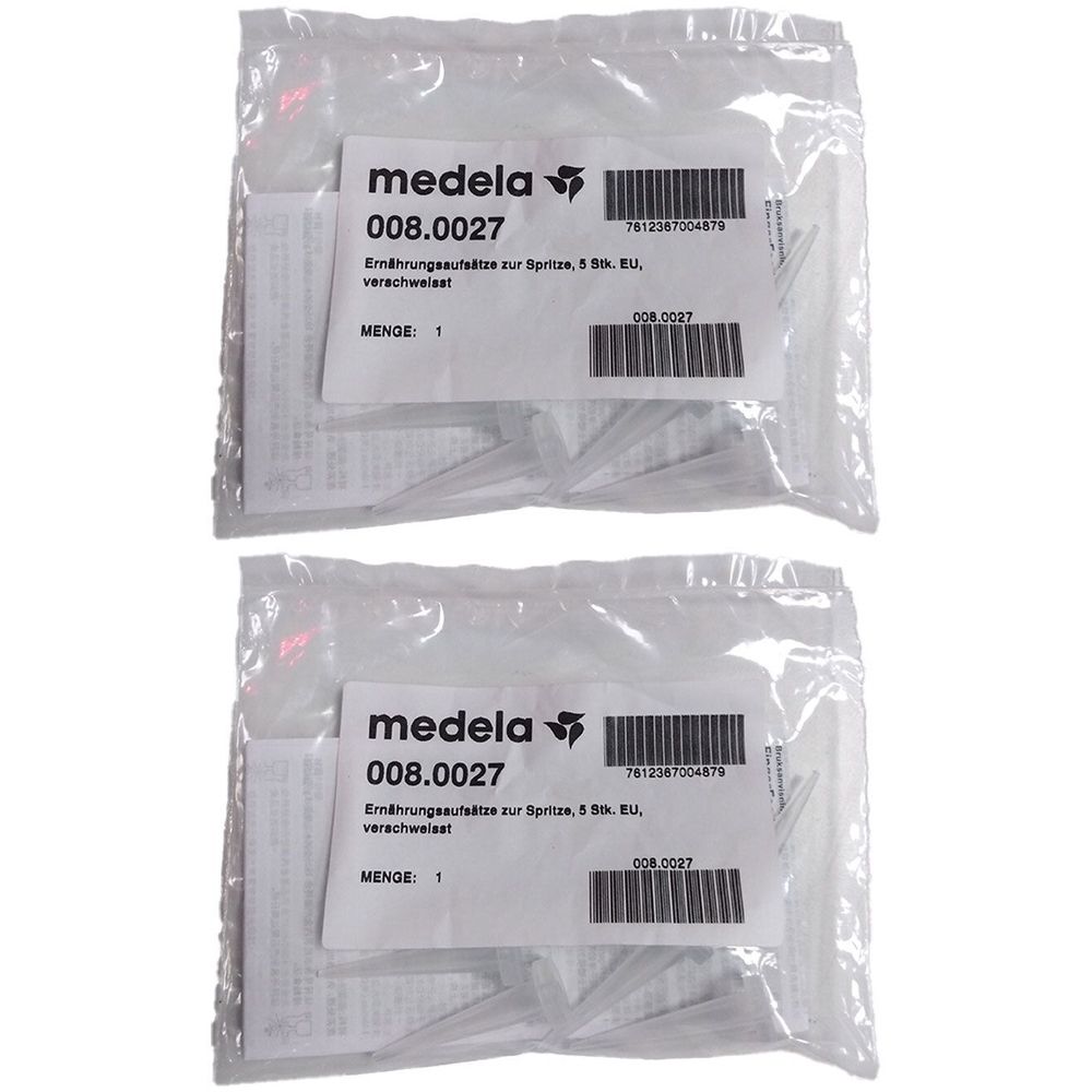 Zwei transparente Beutel mit Etiketten. Auf den Etiketten steht "medela", "008.0027" und Barcodes. Menge: 1.