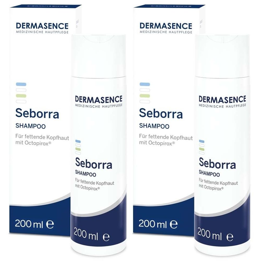 Mehrere Flaschen und Verpackungen von DERMASENCE Seborra Shampoo. Weiß, mit blauer Schrift und Logo. 200 ml.