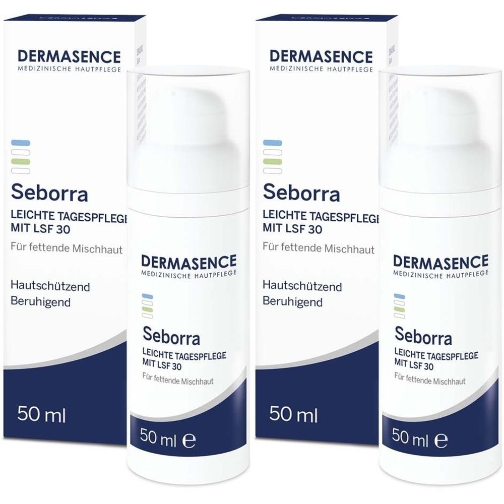 Mehrere Flaschen und Verpackungen von DERMASENCE Seborra Tagespflege LSF 30. Weiße Flaschen mit blau-weißer Beschriftung, 50 ml.