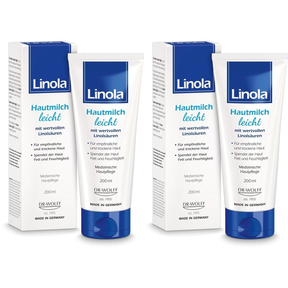 Zwei Tuben und zwei Kartons Linola Hautmilch leicht. Weiße Tuben mit blauem Verschluss. Blaue und weiße Kartons.