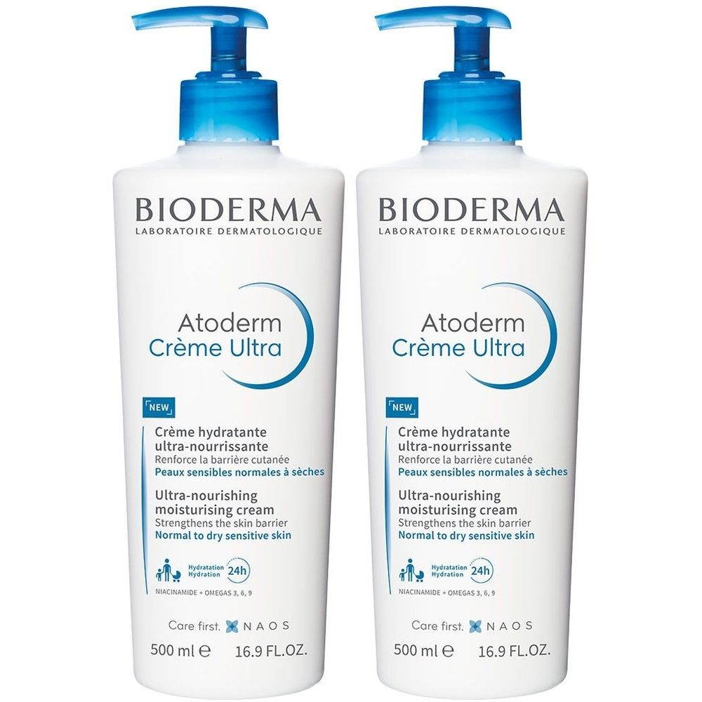 Zwei weiße Flaschen mit blauen Pumpköpfen. Auf jeder Flasche steht "BIODERMA Atoderm Crème Ultra".