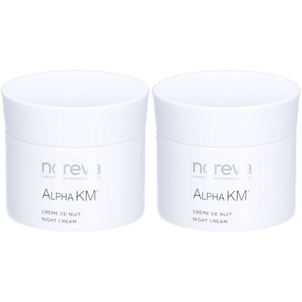 Zwei weiße Tiegel mit Deckel. Aufschrift: noreva, Alpha KM, Crème de Nuit, Night Cream. Kosmetisches Produkt.