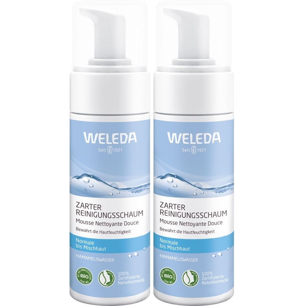Zwei Flaschen Weleda Zarter Reinigungsschaum. Weiße Pumpaufsätze, blaue Etiketten mit Produktinformationen und Logos.