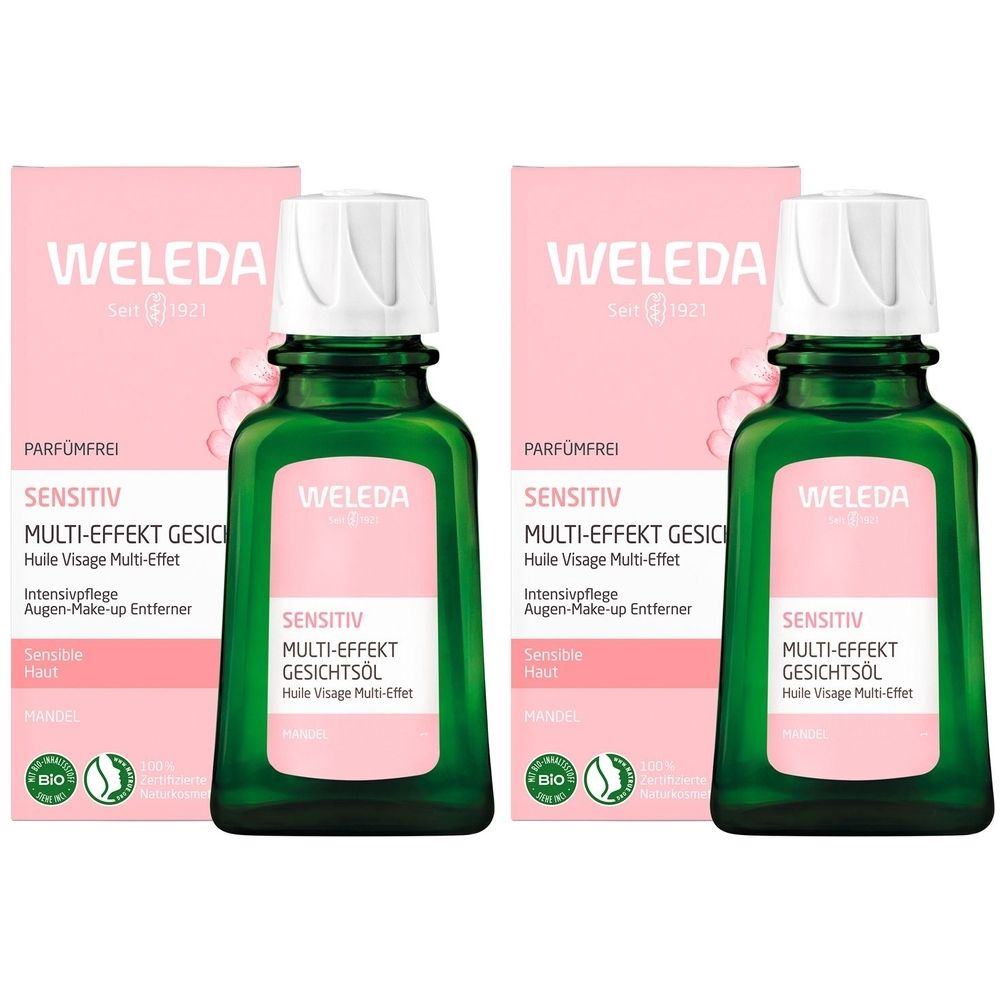 Zwei grüne Glasflaschen mit weißem Verschluss und rosa Verpackung. Aufschrift: Weleda Sensitiv Multi-Effekt Gesichtsöl.