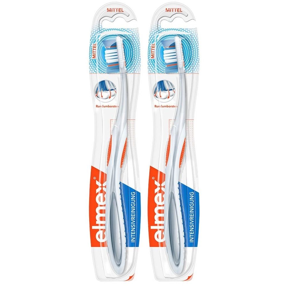 Zwei Zahnbürsten in Verpackung. Weißer Griff mit orangefarbenen Akzenten. Blaue Borsten. Marke: elmex, Intensivreinigung.