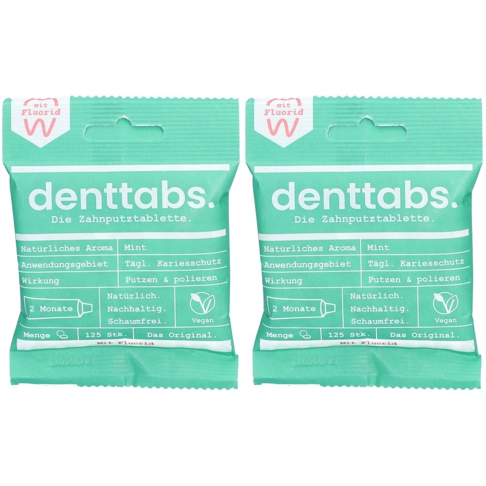 Zwei grüne Verpackungen mit "denttabs"-Schriftzug. Enthält Informationen zu Inhaltsstoffen und Anwendung. Vegan, schaumfrei.