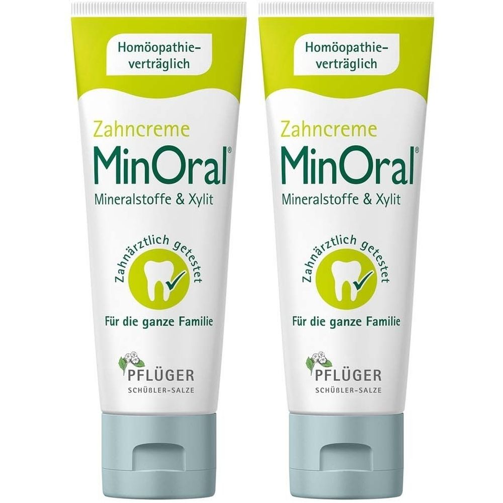 Zwei Tuben Zahncreme. Aufschrift: MinOral, Mineralstoffe & Xylit. Grün-weiße Verpackung. Getestet von Zahnärzten. Für die ganze Familie.