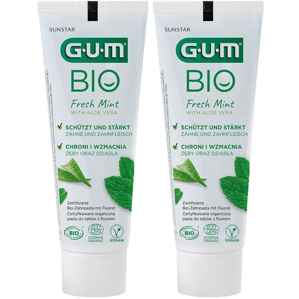 Zwei Tuben GUM BIO Fresh Mint Zahnpasta. Weiße Tuben mit grünem Logo und Text. Enthält Aloe Vera. Zertifiziertes Bio-Produkt.