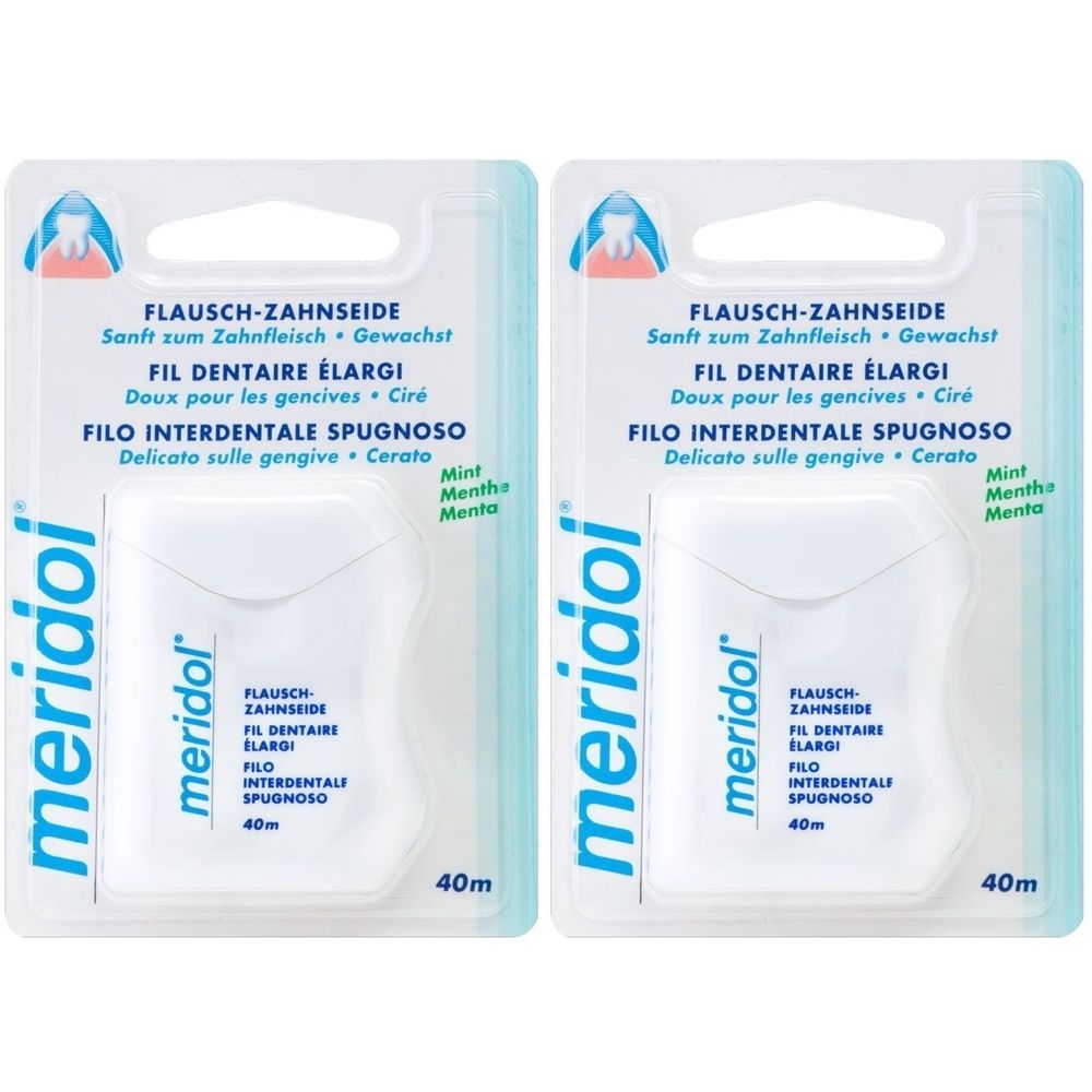 Zwei Packungen Zahnseide in weißer Verpackung. Aufdrucke in Deutsch, Französisch und Italienisch. Marke: meridol. 40m.