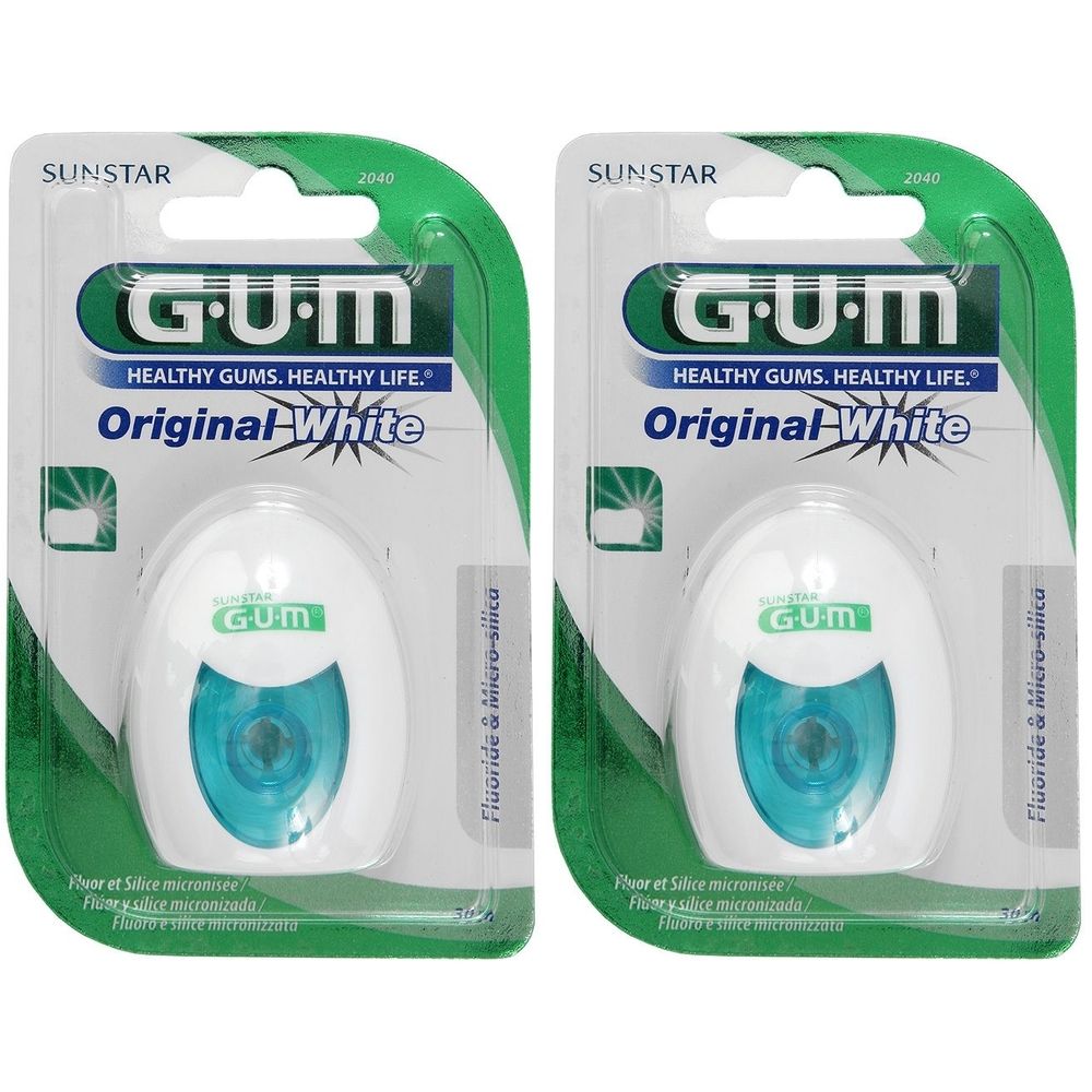 Zwei Packungen Zahnseide. Weiße, ovale Behälter mit blauem Kern, in grüner Verpackung. Aufschrift: GUM Original White.