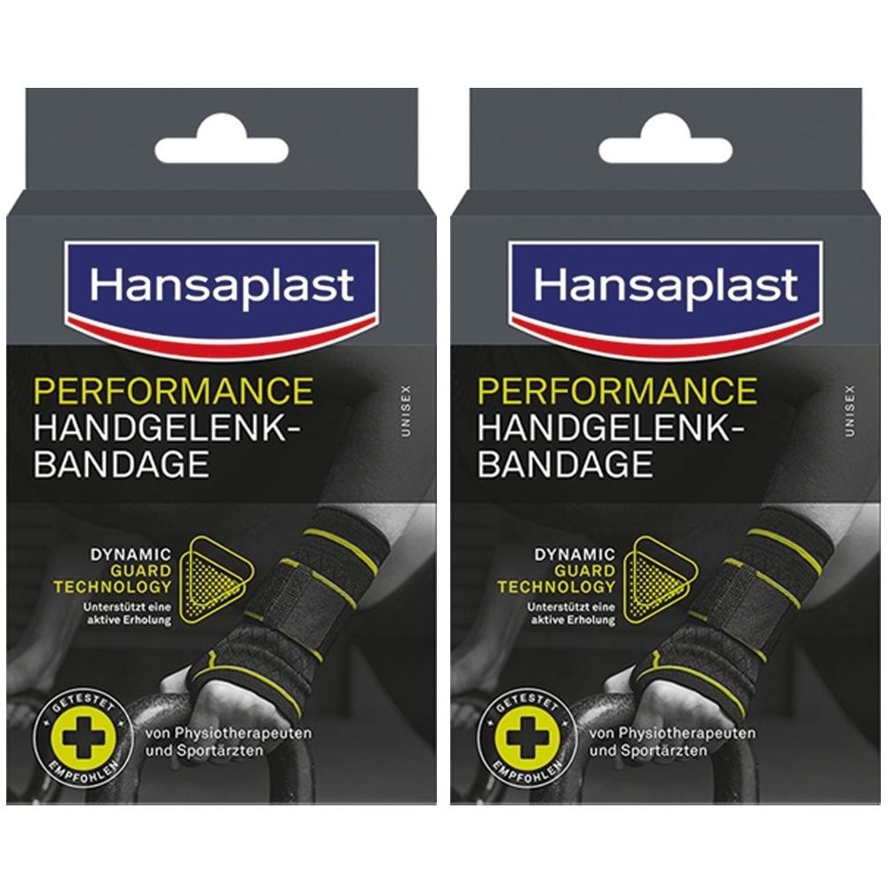 Zwei Hansaplast-Verpackungen. Aufschrift: PERFORMANCE HANDGELENK-BANDAGE. Dynamic Guard Technology. Empfohlen von Physiotherapeuten.