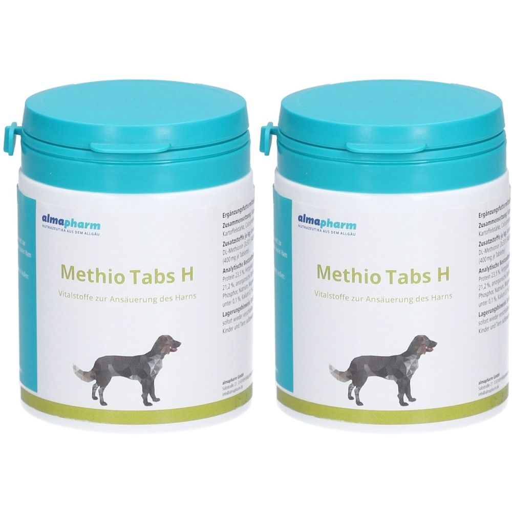 Zwei weiße Dosen mit türkisblauen Deckeln. Aufschrift "Methio Tabs H" und Logo. Abbildung eines Hundes.