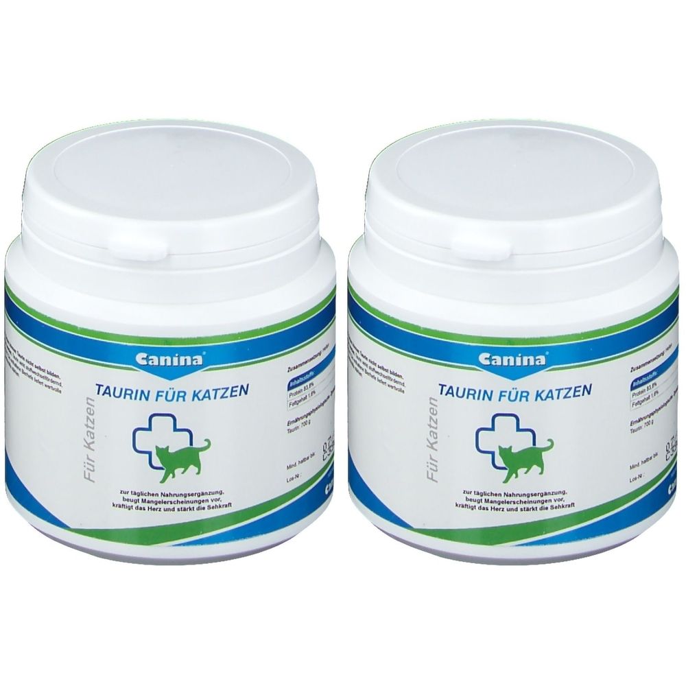 Zwei weiße Dosen mit blau-grüner Banderole. Aufschrift: Canina, TAURIN FÜR KATZEN. Logo: Kreuz mit Katze. Deckel mit Klappverschluss.
