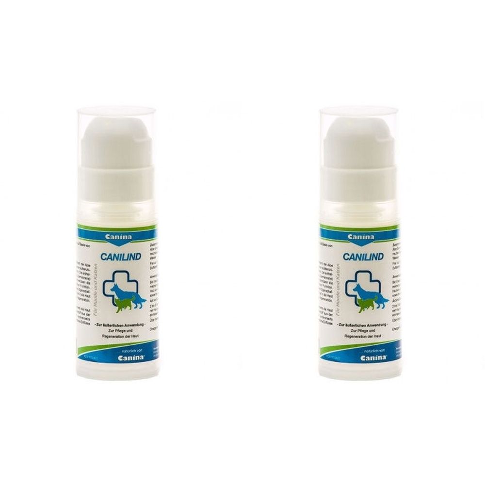 Zwei weiße Flaschen mit blau-grünen Etiketten. Aufschrift: Canina, CANILIND, Logo mit Hund und Kreuz. Pumpverschluss.