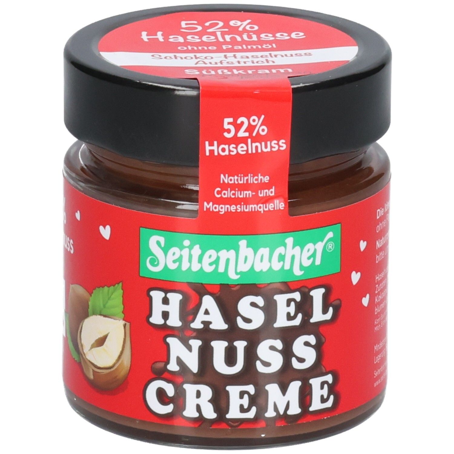 Glas mit Schoko-Haselnuss-Creme. Roter Aufkleber mit 52% Haselnuss. Marke: Seitenbacher. Schwarzer Deckel.