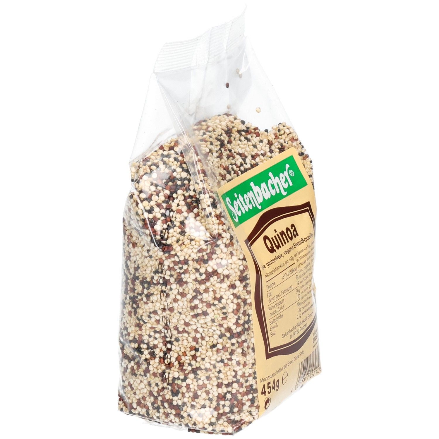 Plastiktüte mit Quinoa, schräg. Aufdruck: Seitenbacher, Quinoa, Nährwertangaben, 454g. Mehrfarbige Körner.