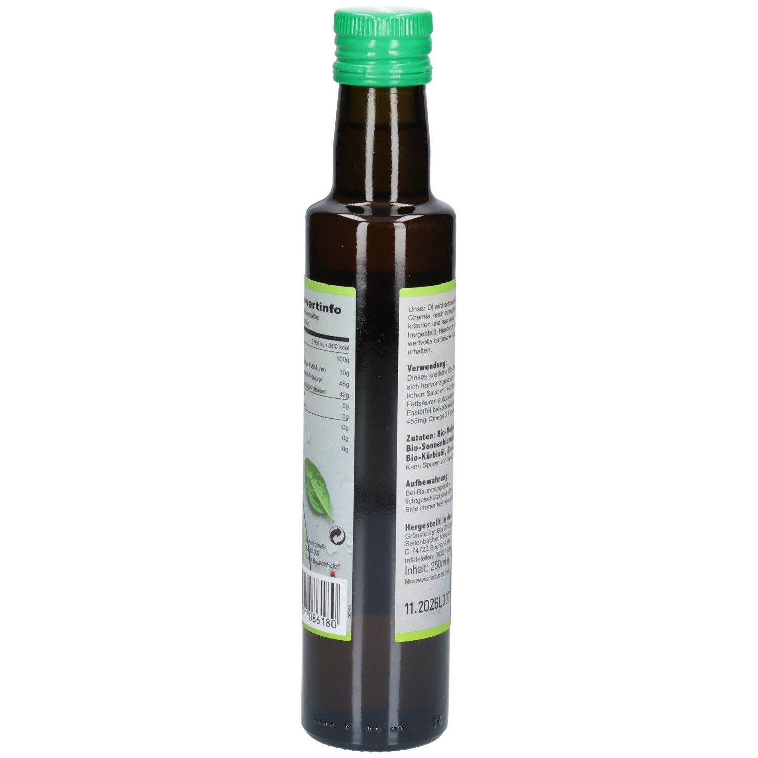 Braune Glasflasche mit grünem Deckel. Etikett mit Nährwertinformationen und Zutaten. Rückseite.