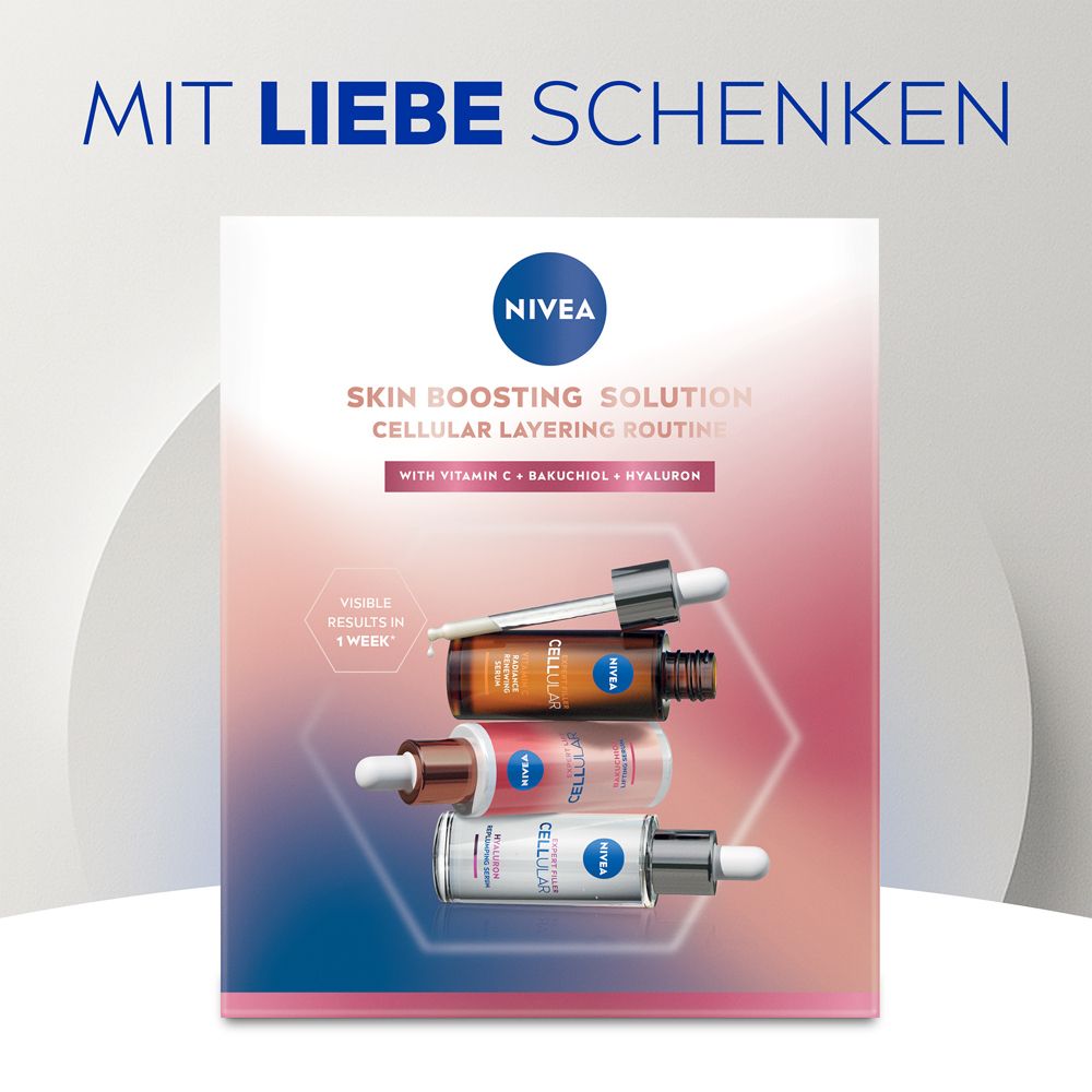 Box mit drei Serumflaschen. Text: NIVEA, Skin Boosting Solution, CELLULAR Layering Routine, mit Vitamin C, Bakuchiol, Hyaluron.