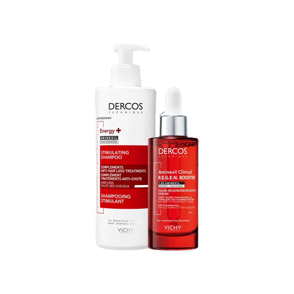 Zwei Produkte: Shampoo-Flasche und Serum-Fläschchen. Beide weiß-rot mit Schriftzug „DERCOS“. Shampoo mit Pumpe, Serum mit Pipette.