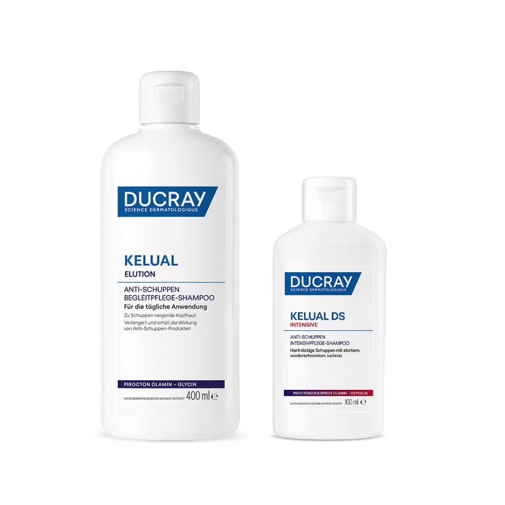 Zwei weiße Flaschen DUCRAY KELUAL Shampoo. Eine größere Flasche mit ELUTION, eine kleinere mit DS INTENSIVE.