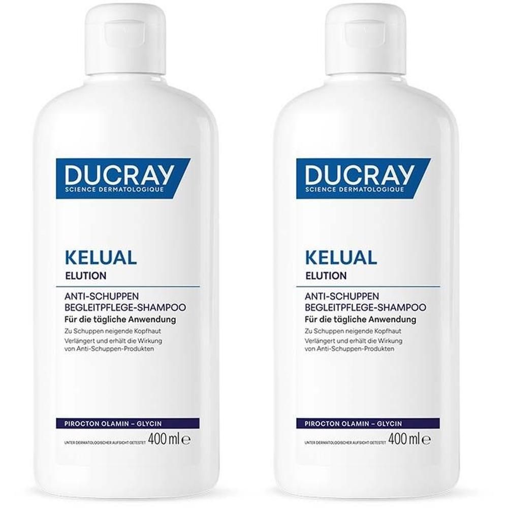 Zwei weiße Flaschen mit blauer Beschriftung. Aufschrift: DUCRAY, KELUAL ELUTION, Anti-Schuppen Begleitpflege-Shampoo, 400 ml.