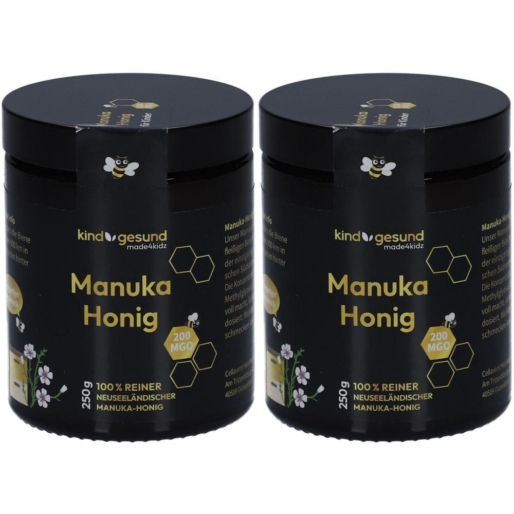 Zwei Gläser kindgesund Manuka Honig, 250g, 200 MGO. Schwarze Etiketten mit Bienen- und Wabenmotiven.