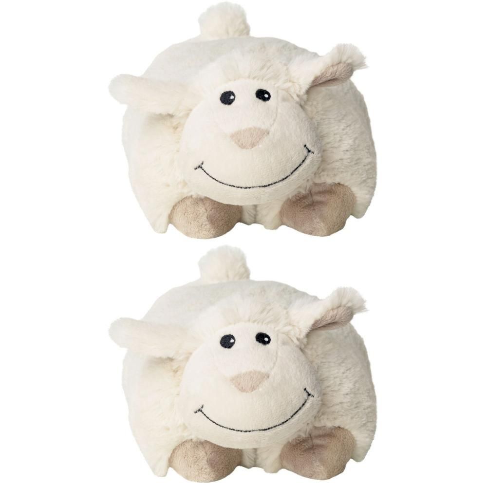 Zwei kuschelige, schafähnliche Wärmekissen. Cremefarbenes Fell, schwarze Augen, lächelnder Mund. Ohren und Füße in Beige. Mit kleinem Schwanz.